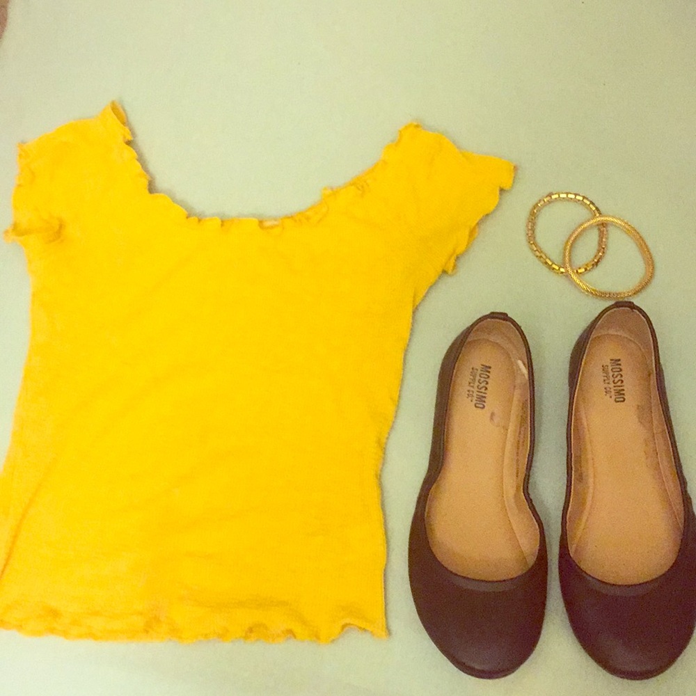 Yellow cropped shirt. Maroon Flats. Gold bracelets